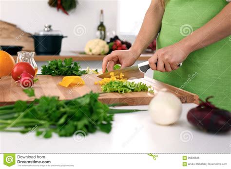 Close Up Of Woman S Hands Cooking In The Kitchen Housewife Slicing