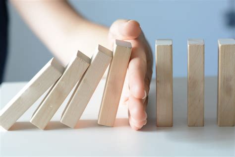 Stopping The Domino Effect Concept With A Business Solution And