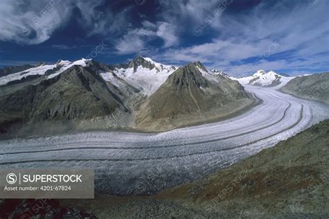 Aletsch Glacier Moving Through The Swiss Alps Showing Lateral And