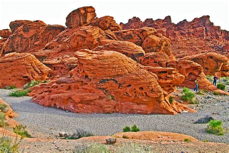 Hikers Exploring Beehive Formations In Valley Of Fire State Park Nevada