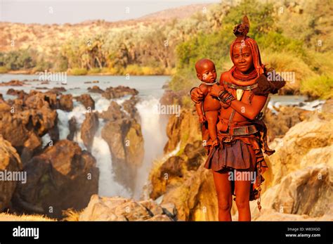 Himba Woman With Baby On Epupa Falls Himbas Normally Are Found Near