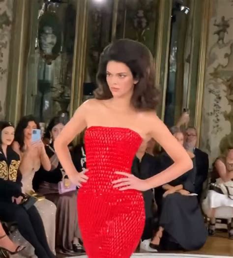 Kendall Jenner Goes Braless In Plunging Pantsuit As She Walks In Friend