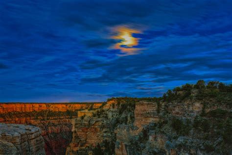Moon Over The Canyon Photograph By John M Bailey