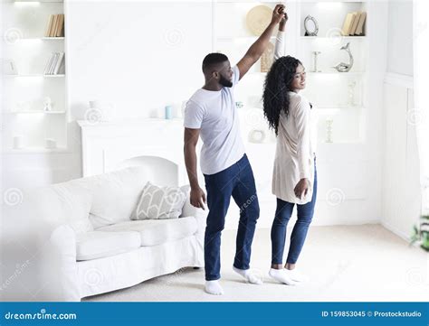 Romantic African American Couple Dancing At Home Holding Hands Stock Image Image Of Joyful