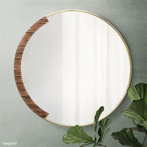 Circular Mirror With A Wooden Backdrop Mirroring Fiddle Leaf Fig On A