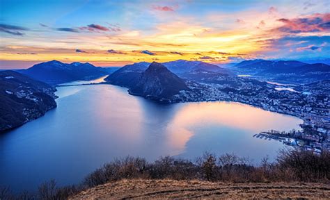 Dramatic Sunset Over Lake Lugano In Swiss Alps Switzerland Stock Photo