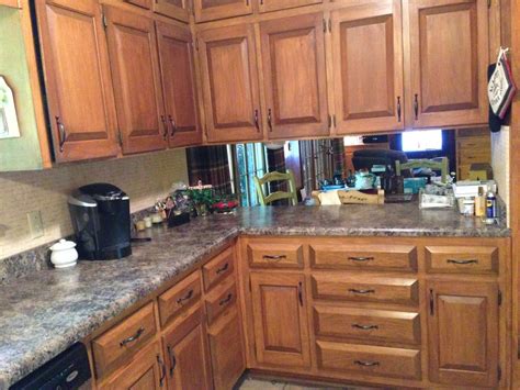 This is not my first rodeo with painting cabinets or wood for that matter. Kitchen cabinets refinished with Rust-Oleum Cabinet Transformations stain kit and new Amerock c ...