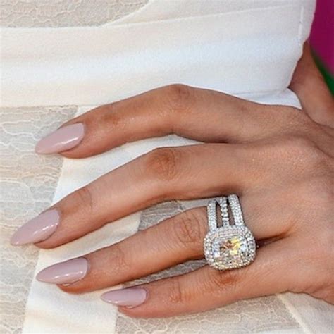 Khloe Kardashians Engagement Ring Reset With Halos Of Diamonds Around