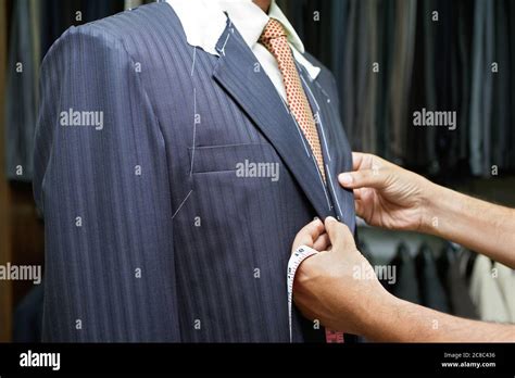 Tailor Fitting Man In Suit Stock Photo Alamy