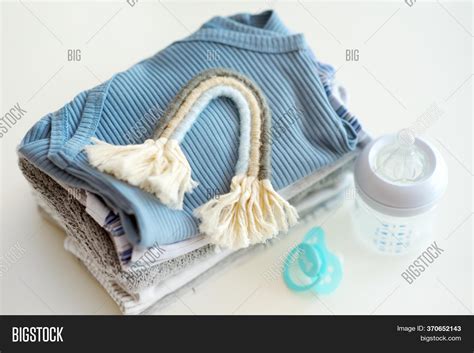 Pile Baby Clothes Image And Photo Free Trial Bigstock