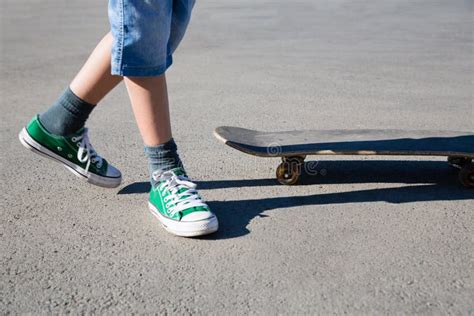 Boy On His Feet And Skate On The Pavement Stock Photo Image Of Young