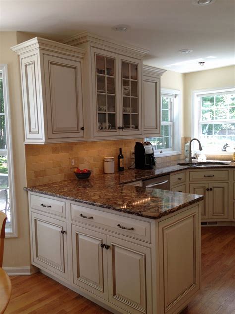 Whitewash kitchen cabinets glazing cabinets distressed kitchen cabinets glazed kitchen cabinets painting bathroom cabinets white painted cabinets with a dark glazed finish completed this kitchen remodel. High-end Cabinet Hardware specially made to enhance any ...