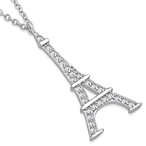 The Eiffel Tower Pendant Is Shown On A Chain With White Diamonds In It