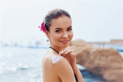 Woman Smile Applying Sunscreen Creme On Tanned Shoulder Skincare Body Sun Protection Sun Cream