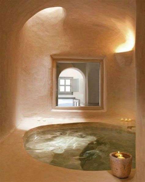 An Indoor Hot Tub With Candles In It