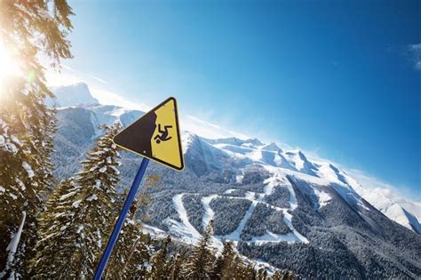 Premium Photo Yellow Warning Sign At A Ski Resort Ski Slopes In The