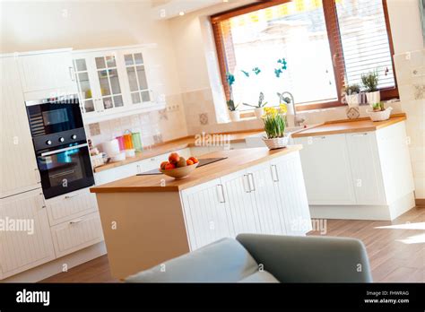 Modern White Kitchen Equipped With Appliances Stock Photo Alamy
