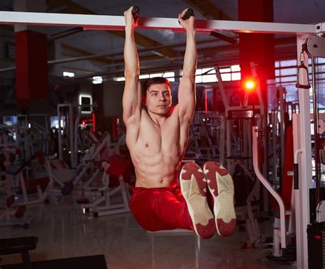 Premium Photo Shirtless Sporty Male Doing Abs Workouts On Pull Up Bar
