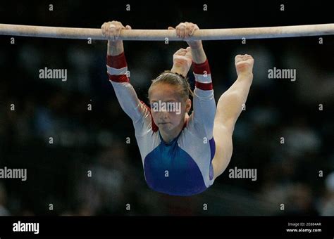 ksenia semenova of russia performs on the asymmetric bars to win the gold medal in the women s