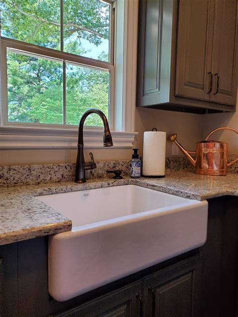 I personally like the apron to but flat and simple but it's nice that there are options on the market if you want something a. White porcelain farmhouse kitchen sink with granite ...