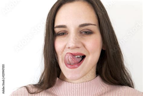 Woman Licking Lips With Happy Expression Stock Photo And Royalty Free