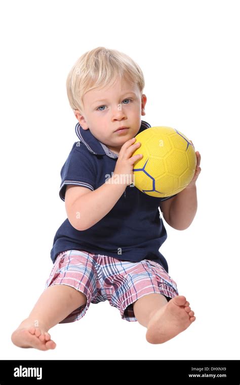 Little Boy Playing With A Ball Stock Photo Alamy