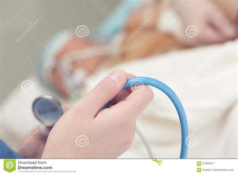Doctor Prepared To Inspect The Critically Ill Patient Stock Image