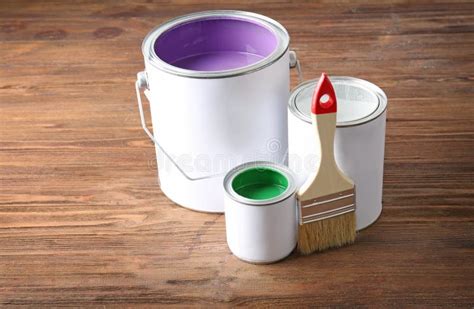 Multicolored Paint In Tin Cans On Wooden Background Stock Image
