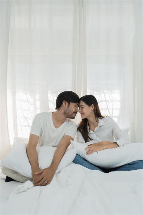 Asian Romantic Couple In Bed Enjoying Sensual Foreplay Happy Sensual