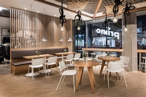 The logo and the quotes are also carefully handpainted onto the wall. Primo Cafe Bar by DIA - Dittel Architekten - Archiscene - Your Daily Architecture & Design Update