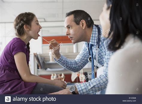 Pediatrician Checking PatientÕs Mouth In Office Stock Photo Alamy