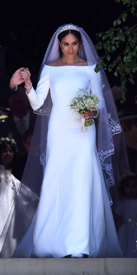 Meghan markle made a dramatic entrance at windor castle saturday for her wedding to prince harry with a long, flowing veil draped over her queen mary diamond bandeau tiara. Meghan Markle's Givenchy wedding dress - full details of ...