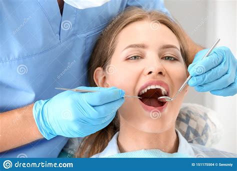 Dentist Examining Patient S Teeth In Clinic Stock Photo Image Of Cure