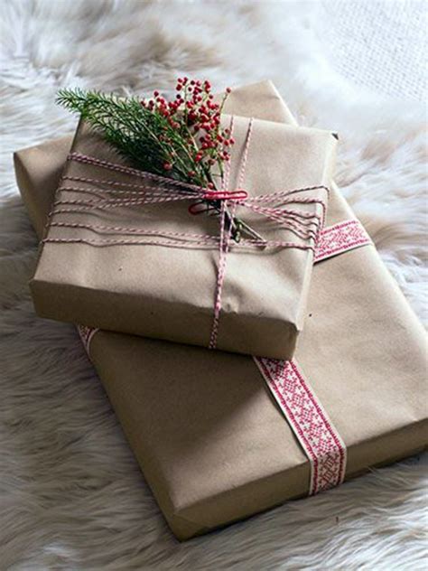 Bring the paper around the box and overlap edges 1 inch to cover the piece already taped. Wrap gifts beautifully - surprises can look good ...