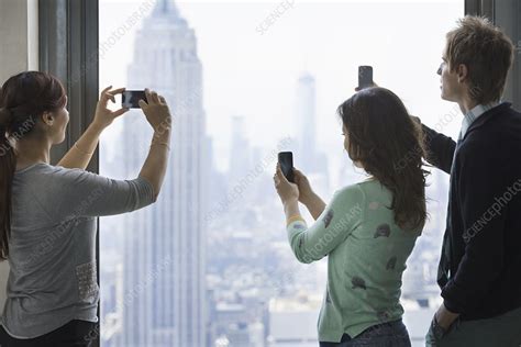 Three People Taking Pictures With Phones Stock Image F0090078