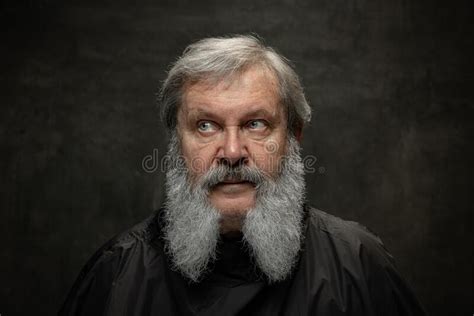 Dramatic Portrait Of Emotional Senior Bearded Man Getting Beard