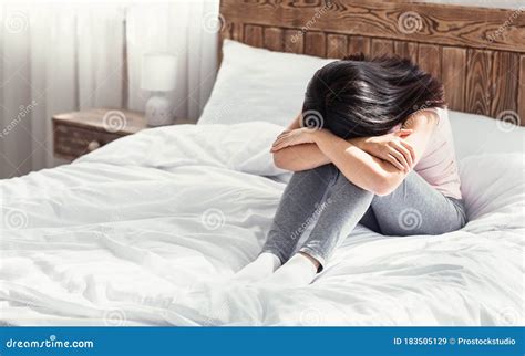 Depressed Asian Woman Crying Sitting On Bed At Home Stock Image Image