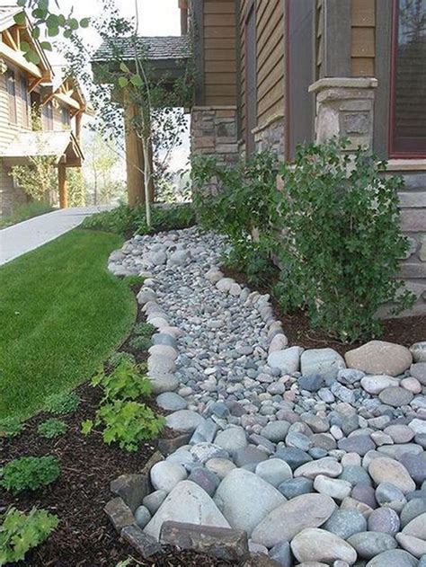 A Rock Garden Bed In Front Of A House