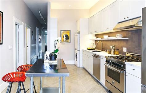 The white cabinetry also draws your eyes upward the tall upper white cabinets in this kitchen seen on homepolish makes the most of the high ceilings. 26 Small Kitchens with White Cabinets - Designing Idea