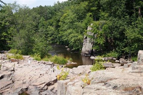 A dam upstream from the falls creates an impoundment, which provides for a swimming beach. Old bridge - Picture of Dells of the Eau Claire River ...