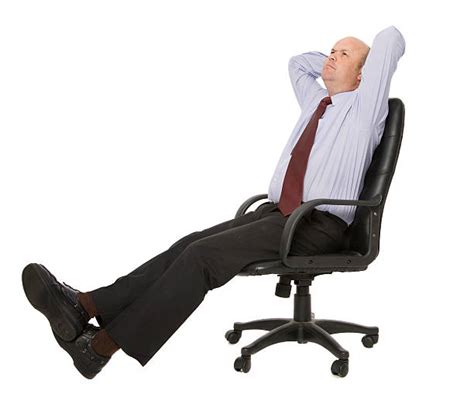 Leaning Back In Chair Stock Photos Pictures And Royalty Free Images Istock