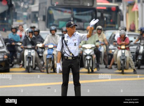 Policeman Directing Traffic During Rush Hour Kuala Lumpur Malaysia