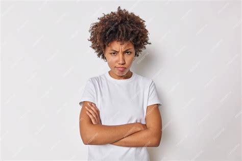 Free Photo Woman Keeps Arms Folded Feels Offended Or Insulted Frowns