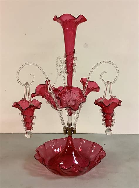 Lot Victorian Cranberry Glass Epergne Vase Measuring 22 5” High With 3 Hanging Glass Baskets