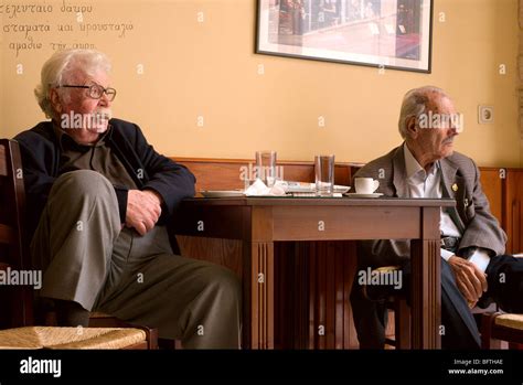 Two Old Men Sitting In A Rethymnon Café Having Morning Coffee Crete