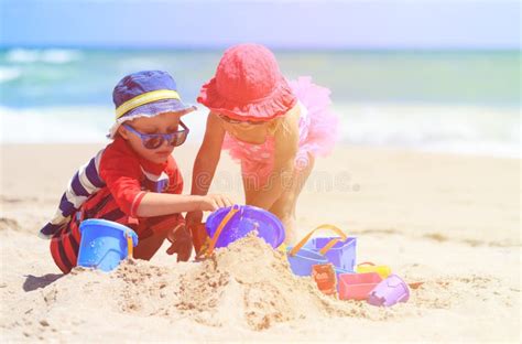 Kids Play With Sand On Summer Beach Stock Image Image Of Playing