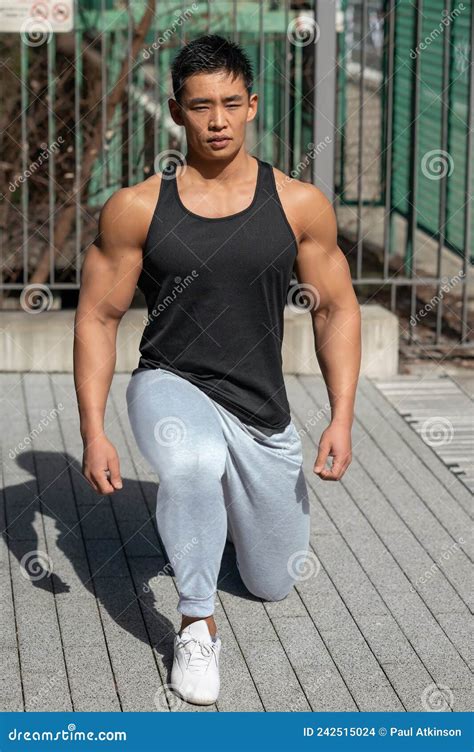 A Muscular Amateur Japanese Bodybuilder In A Tank Top Stock Photo