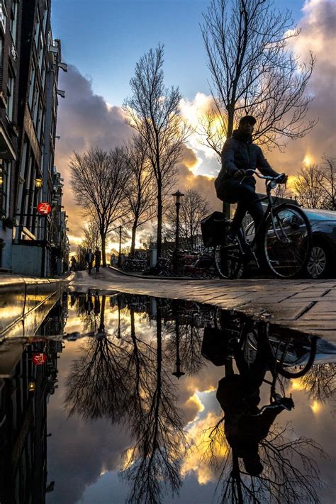 A Puddle Reflection In Amsterdam Rpics