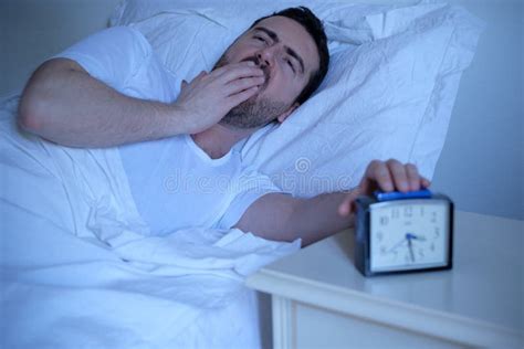 Upset Man Trying To Sleep In His Bed At Night Stock Photo Image Of
