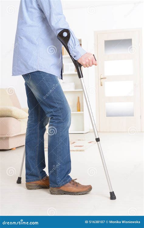 Man With Crutches Stock Photo Image 51638107